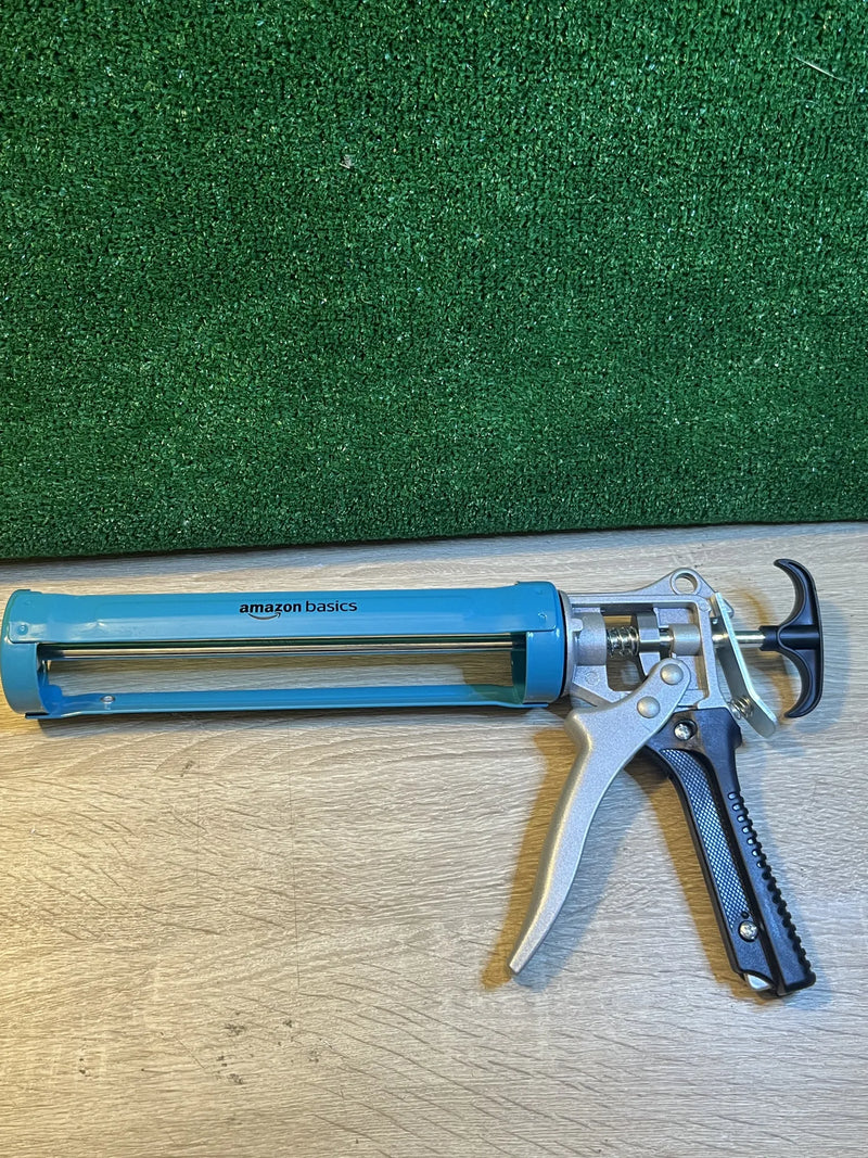 Pistola para sellado de calafateo Amazon Basics