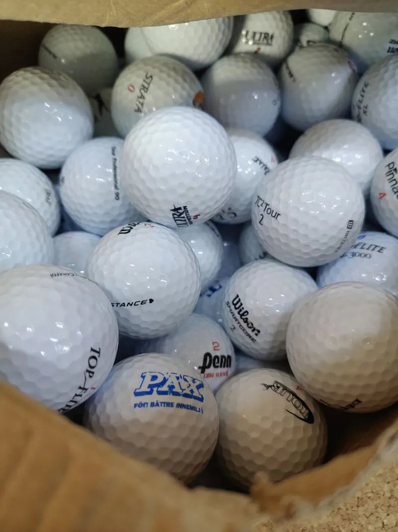 Caja pelotas de golf variadas