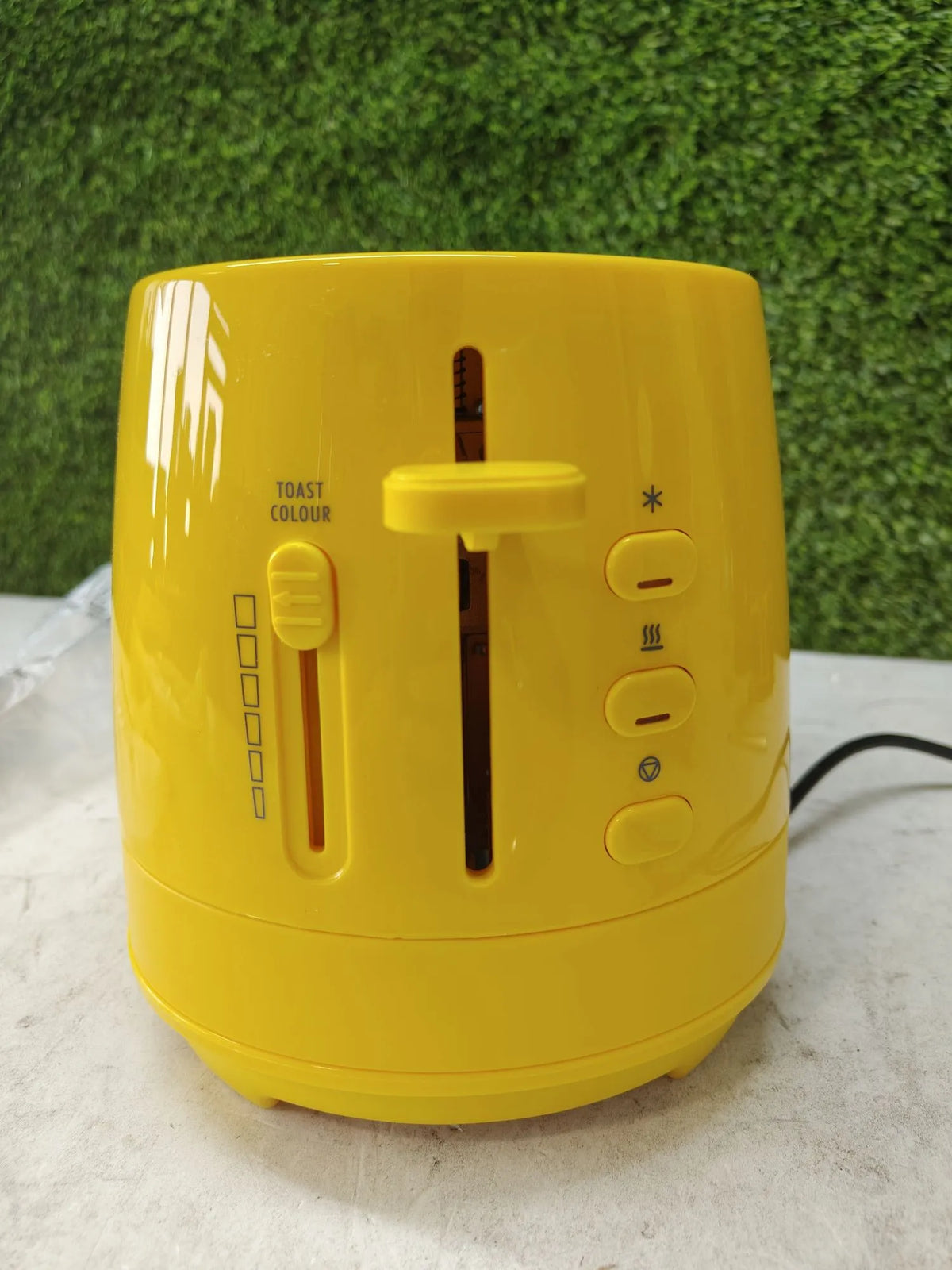 Tostadora con pinzas amarilla - Delonghi